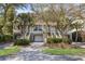 Charming townhomes featuring garages, elevated entryways, and lush landscaping create a welcoming facade at 1902 Long Bend Dr # 1B, Seabrook Island, SC 29455