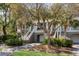 Inviting townhome exteriors featuring elevated entryways and attached garages, nestled among mature trees at 1902 Long Bend Dr # 1B, Seabrook Island, SC 29455