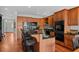 Gourmet kitchen with stainless steel appliances, hardwood floors, and granite countertops at 1902 Long Bend Dr # 1B, Seabrook Island, SC 29455