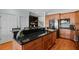 Kitchen island with custom cabinets and black granite countertops at 1902 Long Bend Dr # 1B, Seabrook Island, SC 29455