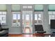 Bright living area boasting ample natural light with expansive windows offering marsh views at 1902 Long Bend Dr # 1B, Seabrook Island, SC 29455