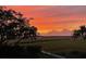 Backyard view of marsh with an orange sky sunset at 1902 Long Bend Dr # 1B, Seabrook Island, SC 29455