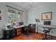 Comfortable home office with a large desk, keyboard, and natural lighting at 1902 Long Bend Dr # 1B, Seabrook Island, SC 29455