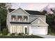 New two-story home featuring traditional architectural details, a front-entry garage and manicured front lawn at 2000 Middleton Dr, Goose Creek, SC 29445