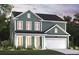 Inviting two-story home with a well-manicured lawn, a two-car garage, and a covered front porch at 2000 Middleton Dr, Goose Creek, SC 29445