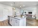 Modern kitchen featuring granite counters, island with breakfast bar, stainless steel appliances, and open floor plan at 2000 Middleton Dr, Goose Creek, SC 29445