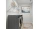 Efficient laundry room featuring modern washer and dryer, shelving for storage, and stylish decor at 2000 Middleton Dr, Goose Creek, SC 29445
