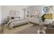 Serene main bedroom with neutral tones, large windows, a dresser, and stylish decor at 2000 Middleton Dr, Goose Creek, SC 29445