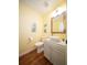 Charming powder room with stylish fixtures, decorative mirror, and a vessel sink at 2009 Arundel Pl, Mount Pleasant, SC 29464