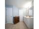 Spacious bathroom with double vanity sinks, tile flooring, and two entry doors at 2009 Arundel Pl, Mount Pleasant, SC 29464