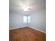 Bright bedroom with hardwood floors, natural light, and neutral walls at 2009 Arundel Pl, Mount Pleasant, SC 29464