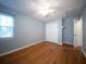 This light-filled bedroom features hardwood floors and a ceiling fan at 2009 Arundel Pl, Mount Pleasant, SC 29464