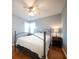 Comfortable bedroom with a cozy bed, ceiling fan, and soft natural light at 2009 Arundel Pl, Mount Pleasant, SC 29464