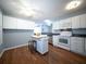Functional kitchen with white cabinets, a center island, and plenty of natural light at 2009 Arundel Pl, Mount Pleasant, SC 29464