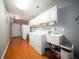 Functional laundry room with ample storage, modern appliances, and a convenient utility sink at 2009 Arundel Pl, Mount Pleasant, SC 29464