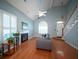 Inviting living room featuring a fireplace, hardwood floors, and a staircase at 2009 Arundel Pl, Mount Pleasant, SC 29464