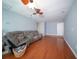 Inviting living room featuring plush seating, ceiling fan, and warm hardwood flooring for cozy comfort at 2009 Arundel Pl, Mount Pleasant, SC 29464