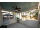 This covered screened porch provides a relaxing view of the fenced backyard at 2009 Arundel Pl, Mount Pleasant, SC 29464