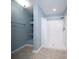 Bright bathroom shower featuring tiled walls and shelving for storage at 2009 Arundel Pl, Mount Pleasant, SC 29464