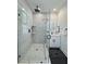 Elegant bathroom with a glass shower, marble tile, vanity, and black fixtures at 2012 Forest Ave, North Charleston, SC 29405
