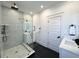 Modern bathroom featuring a glass-enclosed shower, dual sinks, and sleek black fixtures at 2012 Forest Ave, North Charleston, SC 29405