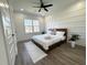 Bright bedroom with a large window, trendy accent wall, and a ceiling fan for added comfort at 2012 Forest Ave, North Charleston, SC 29405