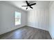 Bright bedroom featuring an accent wall, and a modern ceiling fan at 2012 Forest Ave, North Charleston, SC 29405