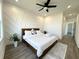 Stylish bedroom with geometric wall paneling, a modern ceiling fan, and wood-look flooring at 2012 Forest Ave, North Charleston, SC 29405