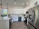 Bright kitchen with quartz countertops, stainless steel appliances, and a modern design at 2012 Forest Ave, North Charleston, SC 29405