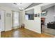 Airy dining area with laminate flooring, a modern chandelier and an open view to the living room at 203 Birmingham Dr, Summerville, SC 29486