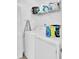 Functional laundry area equipped with a washer and dryer, and storage shelves at 203 Birmingham Dr, Summerville, SC 29486