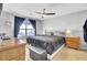 Serene bedroom with a ceiling fan, dark curtains, and a comfortable, well-lit space at 203 Birmingham Dr, Summerville, SC 29486