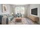 Cozy living room with hardwood floors and modern furniture with many pillows at 203 West Bradford Pointe Dr, Summerville, SC 29483