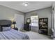 Inviting bedroom with a cozy bed, a full bookshelf, and a dresser under a bright window at 2058 Willowdale Ct, Mount Pleasant, SC 29466