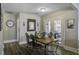 Cozy dining room featuring a rustic wooden table and chairs, leading to an outdoor patio at 2058 Willowdale Ct, Mount Pleasant, SC 29466