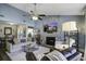 Cozy living room with a stone fireplace and TV mounted above at 2058 Willowdale Ct, Mount Pleasant, SC 29466