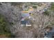 An aerial view shows this neighborhood of single Gathering homes surrounded by mature trees at 206 Braly Dr, Summerville, SC 29485