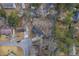 An aerial view shows the home with a circular driveway, mature trees, and easy access to surrounding homes at 206 Braly Dr, Summerville, SC 29485