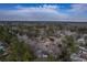 An aerial view shows the neighborhood with single Gathering homes surrounded by a canopy of mature trees at 206 Braly Dr, Summerville, SC 29485