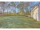 Spacious backyard with lush lawn and mature trees, perfect for outdoor activities and relaxation at 206 Braly Dr, Summerville, SC 29485