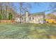The backyard features a well manicured lawn, wooden fence and a covered patio area perfect for entertaining at 206 Braly Dr, Summerville, SC 29485