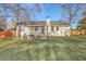 The backyard features an awning covered patio and lush green lawn, ideal for relaxation and entertaining at 206 Braly Dr, Summerville, SC 29485