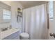 Cozy bathroom with shower, mirror, and shelves, featuring a sink and updated hardware at 206 Braly Dr, Summerville, SC 29485