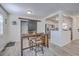 Dining area with stylish table, barn door accent, and view into bright kitchen at 206 Braly Dr, Summerville, SC 29485