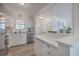 Bright kitchen features white cabinets, stainless steel appliances, hardwood floors, granite countertops, and lots of natural light at 206 Braly Dr, Summerville, SC 29485