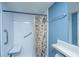 Bright bathroom featuring a tiled shower with built in shower chair and vibrant floral curtain at 21 Rivers Point Row Row # 17 B, Charleston, SC 29412