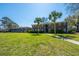 Traditional brick apartment building with palm trees, well-maintained lawn, and pedestrian walkway at 21 Rivers Point Row Row # 17 B, Charleston, SC 29412