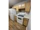Functional kitchen featuring wood cabinets, laminate counters, and white appliances at 21 Rivers Point Row Row # 17 B, Charleston, SC 29412