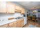 This kitchen shows wood cabinets and countertops, next to an eat-in dining space at 21 Rivers Point Row Row # 17 B, Charleston, SC 29412
