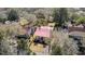 Aerial view of house with mature trees, front porch and landscape at 214 E Doty Ave, Summerville, SC 29483